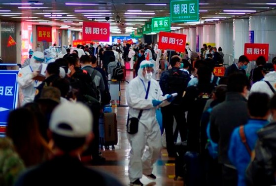Sam McNeil / The Associated PressPassengers from Wuhan stand in lines designating where they will quarantine in Beijing, China, on Wednesday, April 15, 2020. Wuhan, the city at the center of the global coronavirus epidemic, lifted a 76-day lockdown and allowed people to leave for destinations across China. (AP Photo/Sam McNeil)
