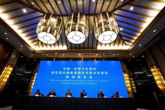 FILE - In this Feb. 9, 2021, file photo, a WHO-China Joint Study Press Conference is held at the end of a WHO mission to investigate the origins of the coronavirus pandemic in Wuhan in central China's Hubei province. A joint WHO-China study on the origins of COVID-19 says that transmission from bats to humans through another animal is the most likely scenario and that a lab leak is “extremely unlikely,