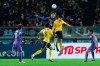 FILE - In this Dec. 20, 2015, file photo, Guangzhou Evergrande FC's Zheng Long, right, and Sanfrecce Hiroshima's Tsukasa Shiotani, left, leap to head the ball during their match for the third place at the FIFA Club World Cup soccer tournament in Yokohama, near Tokyo. The Chinese Super League is reportedly set to kick off in the last week of June 2020, two weeks after lower-tier leagues are scheduled to begin in the wake of the coronavirus pandemic that has shut down sports globally.(AP Photo/Shuji Kajiyama, File)