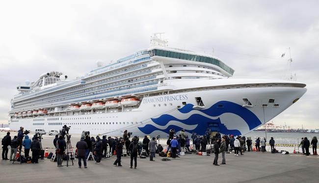 The cruise ship Diamond Princess is anchored at Yokohama Port for supplies replenished in Yokohama, south of Tokyo, Thursday, Feb. 6, 2020. The 3,700 people on board faced a two-week quarantine in their cabins. Health workers said 10 more people from the Diamond Princess were confirmed sickened with the virus, in addition to 10 others who tested positive on Wednesday. The 10 will be dropped off as the ship docks and transferred to nearby hospitals for further test and treatment. (Hiroki Yamauchi/Kyodo News via AP)