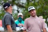 Bubba Watson, right, talks with Brian Harman as they wait to tee off on the No. 7 hole during a round of 16 match at the Dell Technologies Match Play Championship golf tournament Saturday, March 27, 2021, in Austin, Texas. (AP Photo/David J. Phillip)