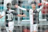 Juventus' Cristiano Ronaldo, right, celebrates with teammate Paulo Dybala after scoring a goal during the Italian Serie A soccer match between Juventus and Udinese at the Allianz Stadium in Turin, Italy, Sunday, Dec. 15, 2019. (Alessandro Di Marco/ANSA via AP)