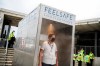 A man passes through an anti COVID-19 automatic gate meant to speed up checks at the entrance of the Grande Torino stadium in Turin, Italy, where the Italian Serie A soccer match between Torino and Verona is taking place Wednesday, July 22, 2020. The device, dubbed 