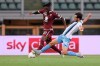 Torino's Soualiho Meite is tackled by Lazio's Marco Parolo during the Italian Serie A soccer match between Torino and Lazio at the Olimpico Grande Torino stadium in Turin, Italy Tuesday, June 30, 2020. (Fabio Ferrari/LaPresse via AP)