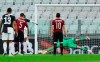 Juventus' Cristiano Ronaldo hits the post on a penalty kick as AC Milan goalie Gianluigi Donnarumma dives, during an Italian Cup second leg soccer match between Juventus and AC Milan at the Allianz stadium, in Turin, Italy, Friday, June 12, 2020. The match was being played without spectators because of the coronavirus lockdown. (Spada/LaPresse via AP)