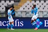Napoli's Victor Osimhen, right, celebrates with Lorenzo Insigne after scoring his side's 2nd goal, during the Serie A soccer match between Torino and Napoli, at the Olympic stadium in Turin, Italy, Monday, April 26, 2021. (Fabio Ferrari/LaPresse via AP)
