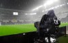 A cameramen films the Allianz Stadium in Turin, Italy, Sunday, Oct. 4, 2020 ahead of the scheduled Serie A soccer match between Juventus and Napoli. Napoli is likely to be handed a 3-0 loss by the Italian league‚Äôs judge for failing to show for its Serie A match at Juventus on Sunday night. Napoli did not travel to Turin for the match after local health authorities ordered the squad into quarantine after two players tested positive for the coronavirus. (Tano Pecoraro/LaPresse via AP)