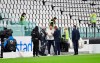 Juventus goalie Gianluigi Buffon, centre, stands on the pitch of the Allianz Stadium in Turin, Italy, Sunday, Oct. 4, 2020 ahead of the scheduled Serie A soccer match between Juventus and Napoli. Napoli is likely to be handed a 3-0 loss by the Italian league’s judge for failing to show for its Serie A match at Juventus on Sunday night. Napoli did not travel to Turin for the match after local health authorities ordered the squad into quarantine after two players tested positive for the coronavirus. (Tano Pecoraro/LaPresse via AP)