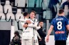 Juventus' Federico Chiesa, 2nd left, celebrates with Cristiano Ronaldo after scoring during the Serie A soccer match between Juventus and Atalanta, at the Allianz Stadium in Turin, Italy, Wednesday, Dec. 16, 2020. (Marco Alpozzi/LaPresse via AP)