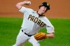 San Diego Padres' Garrett Richards delivers against the Los Angeles Dodgers during the eighth inning in Game 3 of a baseball National League Division Series Thursday, Oct. 8, 2020, in Arlington, Texas. (AP Photo/Tony Gutierrez)