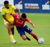 FC Dallas forward Franco Jara (29) is pulled down by Nashville SC midfielder Anibal Godoy (20) during the first half of an MLS soccer game at Toyota Stadium on Wednesday, Aug. 12, 2020, in Frisco, Texas.(Smiley N. Pool/The Dallas Morning News via AP)