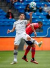 Montreal Impact defender Jorge Corrales, left, receives the ball past FC Dallas defender Reggie Cannon (2) during the first half of an MLS soccer match Saturday, March 7, 2020, in Frisco, Texas. (Ryan Michalesko/The Dallas Morning News via AP)