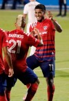 FC Dallas midfielder Santiago Mosquera (11) celebrates his first goal by dancing with midfielder Michael Barrios (21) during the first half of the team's MLS soccer match against the Colorado Rapids in Frisco, Texas, Wednesday, Sept. 16, 2020. (Stewart F. House/The Dallas Morning News via AP)