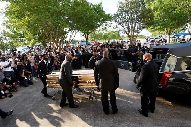 The casket of George Floyd is removed after a public visitation for Floyd at the Fountain of Praise church, Monday, June 8, 2020, in Houston. (AP Photo/David J. Phillip, Pool)