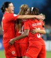 Canada's Christine Sinclair (19) and teammates Shelina Zadorsky(4) and Kadeisha Buchanan (5) celebrate a goal during a CONCACAF women's Olympic qualifying soccer match against Mexico, Tuesday, Feb. 4, 2020, in Edinburg, Texas. (AP Photo/Delcia Lopez)