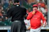 Los Angeles Angels manager Joe Maddon, right, argues a batter interference call by home plate umpire Brian O'Nora, left, during the first inning of a baseball game against the Houston Astros Friday, April 23, 2021, in Houston. (AP Photo/David J. Phillip)