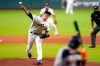 Houston Astros starting pitcher Zack Greinke, left, throws to San Francisco Giants' Wilmer Flores during the first inning of a baseball game Wednesday, Aug. 12, 2020, in Houston. (AP Photo/David J. Phillip)