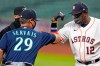 Houston Astros' Dusty Baker (12) bumps elbows with Seattle Mariners manager Scott Servais (29) before a baseball game Saturday, July 25, 2020, in Houston. (AP Photo/David J. Phillip)