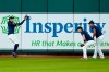 Houston Astros center fielder George Springer, left, makes a catch as outfielders Josh Reddick, center, and Michael Brantley watch during a baseball practice at Minute Maid Park, Sunday, July 5, 2020, in Houston. (AP Photo/David J. Phillip)