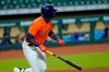 Houston Astros' Yordan Alvarez watches his three-run home run against the Seattle Mariners during the first inning of a baseball game Friday, Aug. 14, 2020, in Houston. (AP Photo/David J. Phillip)