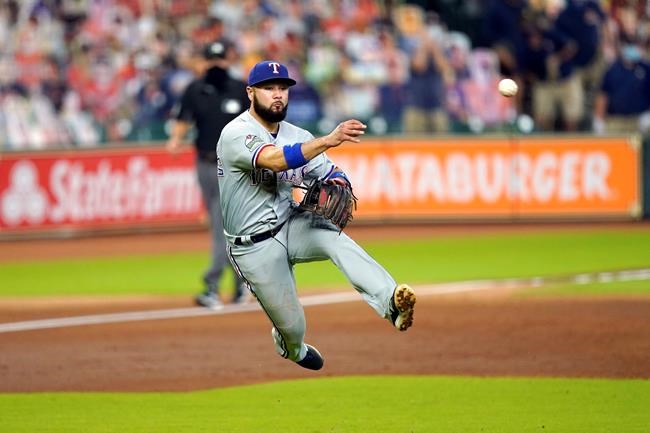 Texas Rangers third baseman Isiah Kiner-Falefa throws to first for the out after fielding a ground ball by Houston Astros' Alex Bregman during the third inning of a baseball game Thursday, Sept. 17, 2020, in Houston. (AP Photo/David J. Phillip)