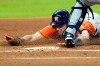 Houston Astros' Kyle Tucker scores during the first inning of a baseball game against the Seattle Mariners Friday, Aug. 14, 2020, in Houston. (AP Photo/David J. Phillip)