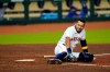 Houston Astros' Carlos Correa waits for medical attention after fouling a pitch off his leg during the sixth inning of a baseball game against the Texas Rangers Tuesday, Sept. 15, 2020, in Houston. Correa left the game after the injury. (AP Photo/David J. Phillip)