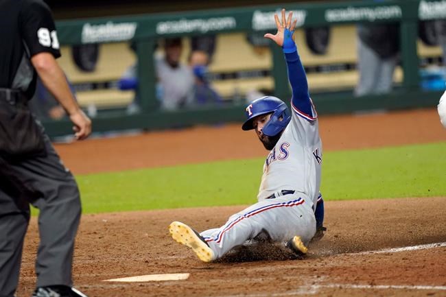 Texas Rangers' Isiah Kiner-Falefa scores during the 10th inning of a baseball game against the Houston Astros Tuesday, Sept. 1, 2020, in Houston. (AP Photo/David J. Phillip)