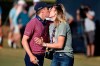 Carlos Ortiz, left, kisses wife, Haley Ortiz, after winning the Houston Open golf tournament, Sunday, Nov. 8, 2020, in Houston. (AP Photo/Eric Christian Smith)
