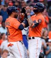 Houston Astros' Carlos Correa, right, celebrates his two-run home run with Yuli Gurriel during the second inning of baseball game against the Toronto Blue Jays, Friday, May 7, 2021, in Houston. (AP Photo/Eric Christian Smith)