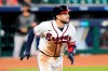 Atlanta Braves' Travis d'Arnaud watches the ball he hit for a three-run home run during the seventh inning in Game 1 of a baseball National League against the Miami Marlins Division Series Tuesday, Oct. 6, 2020, in Houston. (AP Photo/Eric Gay)