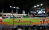 The Oakland Athletics and the Houston Astros stand together in a moment of silence before leaving the field without playing their scheduled baseball game in a protest of racial injustice Friday, Aug. 28, 2020, in Houston. (Kevin M. Cox/The Galveston County Daily News via AP)