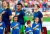 United States midfielder Samantha Mewis (3), goalkeeper Adrianna Franch, center, and forward Megan Rapinoe, right, stand with their jerseys turned inside out during the playing of the national anthem before a SheBelieves Cup women's soccer match against Japan, Wednesday, March 11, 2020 at Toyota Stadium in Frisco, Texas. (AP Photo/Jeffrey McWhorter)