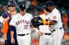 Houston Astros starting pitcher Jake Odorizzi (17) hands the ball off to manager Dusty Baker Jr. (12) as he leaves the mound with an injury on the second batter of the first inning of a baseball game agains the Los Angeles Angels Saturday, April 24, 2021, in Houston. (AP Photo/Michael Wyke)