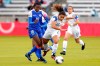 Costa Rica forward Raquel Rodriguez (11) falls while chasing the ball as she is pushed from behind by Haiti forward Nerilia Mondesir (10) during the first half of a CONCACAF women's Olympic qualifying soccer match Friday, Jan. 31, 2020, in Houston. (AP Photo/Michael Wyke)