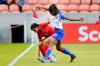 Panama defender Hilary Jaen (4) grabs the jersey of Haiti forward Batcheba Louis (7) as they battle for the ball during the first half of a CONCACAF women's Olympic qualifying soccer match Monday, Feb. 3, 2020, in Houston. (AP Photo/Michael Wyke)