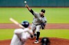 Colorado Rockies starting pitcher Antonio Senzatela, top, throws against Houston Astros batter Alex Bregman, left, during the first inning inning of a baseball game Tuesday, Aug. 18, 2020, in Houston. (AP Photo/Michael Wyke)
