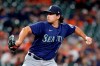 Seattle Mariners starting pitcher Marco Gonzales winds up during the first inning of the team's baseball game against the Houston Astros on Tuesday, April 27, 2021, in Houston. (AP Photo/Michael Wyke)