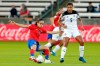 Costa Rica midfielder Katherine Alvarado, left, kicks away the ball in from of Panama defender Yerenis De Leon (5) during the first half of a women's Olympic qualifying soccer match Tuesday, Jan. 28, 2020, in Houston. (AP Photo/Michael Wyke)