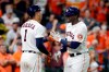 Houston Astros' Carlos Correa (1) and Yordan Alvarez, right, celebrate Alvarez's home run against the Oakland Athletics during the sixth inning of a baseball game Thursday, April 8, 2021, in Houston. (AP Photo/Michael Wyke)