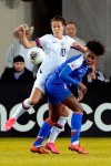United States forward Carli Lloyd (10) and Haiti defender Soveline Beaubrun, right, collide as they go for the ball during the first half of a women's Olympic qualifying soccer match Tuesday, Jan. 28, 2020, in Houston. (AP Photo/Michael Wyke)