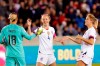 U.S. goalkeeper Ashlyn Harris (18), defender Becky Sauerbrunn (4) and defender Abby Dahlkemper, right, celebrate the team's 8-0 win over Panama in a CONCACAF women's Olympic qualifying soccer match Friday, Jan. 31, 2020, in Houston. (AP Photo/Michael Wyke)