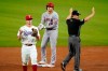 Texas Rangers second baseman Nick Solak throws the ball in as Los Angeles Angels' Shohei Ohtani stands on second with a double to left in the second inning of a baseball game in Arlington, Texas, Wednesday, April 28, 2021. Umpire D.J. Reyburn signals to the field after the play. (AP Photo/Tony Gutierrez)