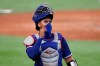 Texas Rangers catcher Robinson Chirinos adjusts his mask as he walks back to the dugout during a baseball practice at Globe Life Field in Arlington, Texas, Thursday, July 9, 2020. (AP Photo/Tony Gutierrez)