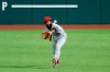 Los Angeles Angels right fielder Brian Goodwin reaches forward to field a sacrifice fly by Texas Rangers' Robinson Chirinos in the second inning of a baseball game in Arlington, Texas, Friday, Aug. 7, 2020. The Rangers' Willie Calhoun scored on the play. (AP Photo/Tony Gutierrez)
