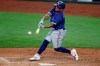 Texas Rangers' Willie Calhoun connects for a hit during an intrasquad practice baseball game at Globe Life Field in Arlington, Texas, Monday, July 6, 2020. (AP Photo/Tony Gutierrez)