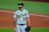 Oakland Athletics' Mike Fiers pauses on the mound as he works against the Texas Rangers during the fourth inning of a baseball game in Arlington, Texas, Wednesday Aug. 26, 2020. (AP Photo/Tony Gutierrez)