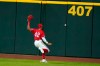 CORRECTS TO DOUBLE NOT SINGLE - Texas Rangers center fielder Leody Taveras chases after a run-scoring double by Los Angeles Dodgers' Corey Seager in the seventh inning of a baseball game in Arlington, Texas, Friday, Aug. 28, 2020. Dodgers' Will Smith scored on the hit. (AP Photo/Tony Gutierrez)