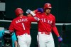 Texas Rangers' Elvis Andrus (1) celebrates his solo home run with Ronald Guzman, right, in the seventh inning of a baseball game against the Oakland Athletics in Arlington, Texas, Friday, Sept. 11, 2020. (AP Photo/Tony Gutierrez)