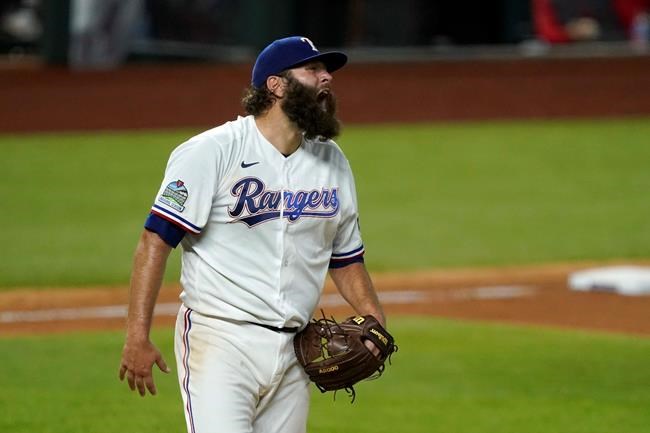 Texas Rangers starting pitcher Lance Lynn yells out after walking Los Angeles Angels' Jo Adell in the seventh inning of a baseball game in Arlington, Texas, Tuesday, Sept. 8, 2020. (AP Photo/Tony Gutierrez)